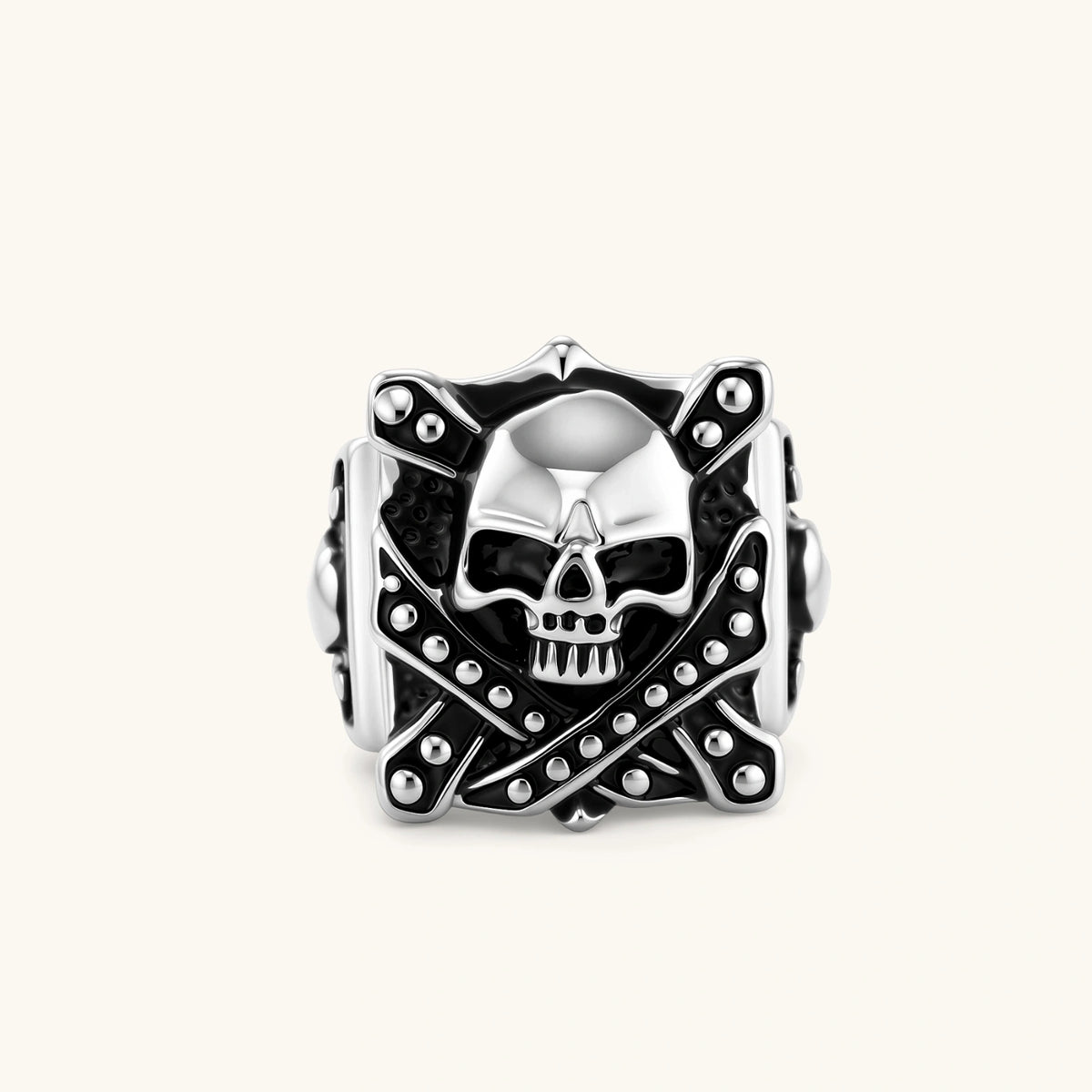 Silver-tone 316L stainless steel skull ring with crossbones, black enamel fill, studded details, and wide shank, 21mm top width.