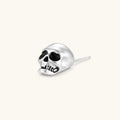 Matte silver skull stud earring with black enamel eye sockets and detailed teeth, post backing, 316L stainless steel.