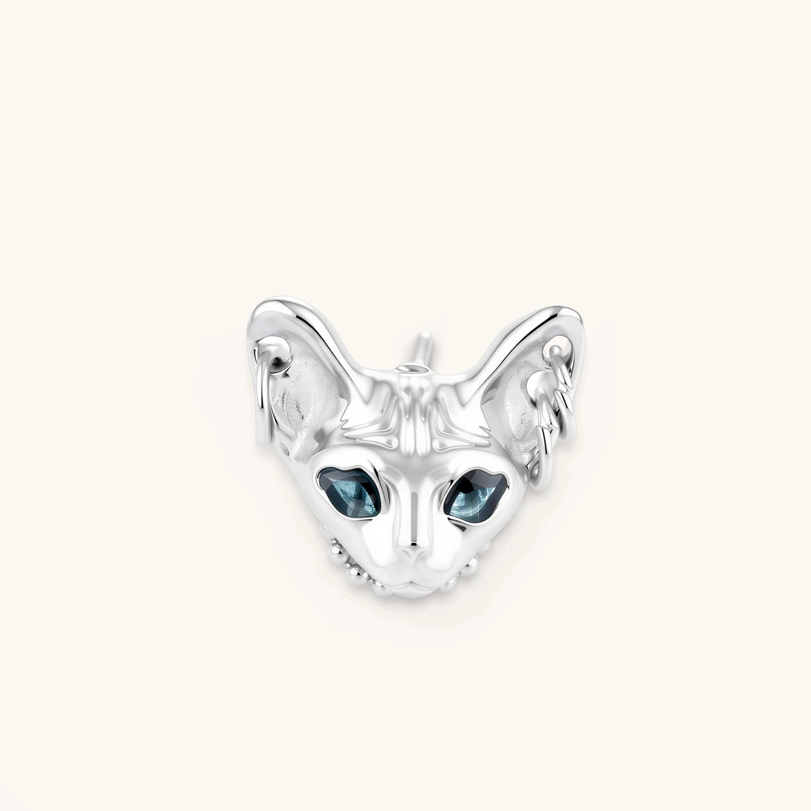 3D sculpted stainless steel Sphynx cat head stud earring with blue CZ eyes and hoop ear details, silver finish.