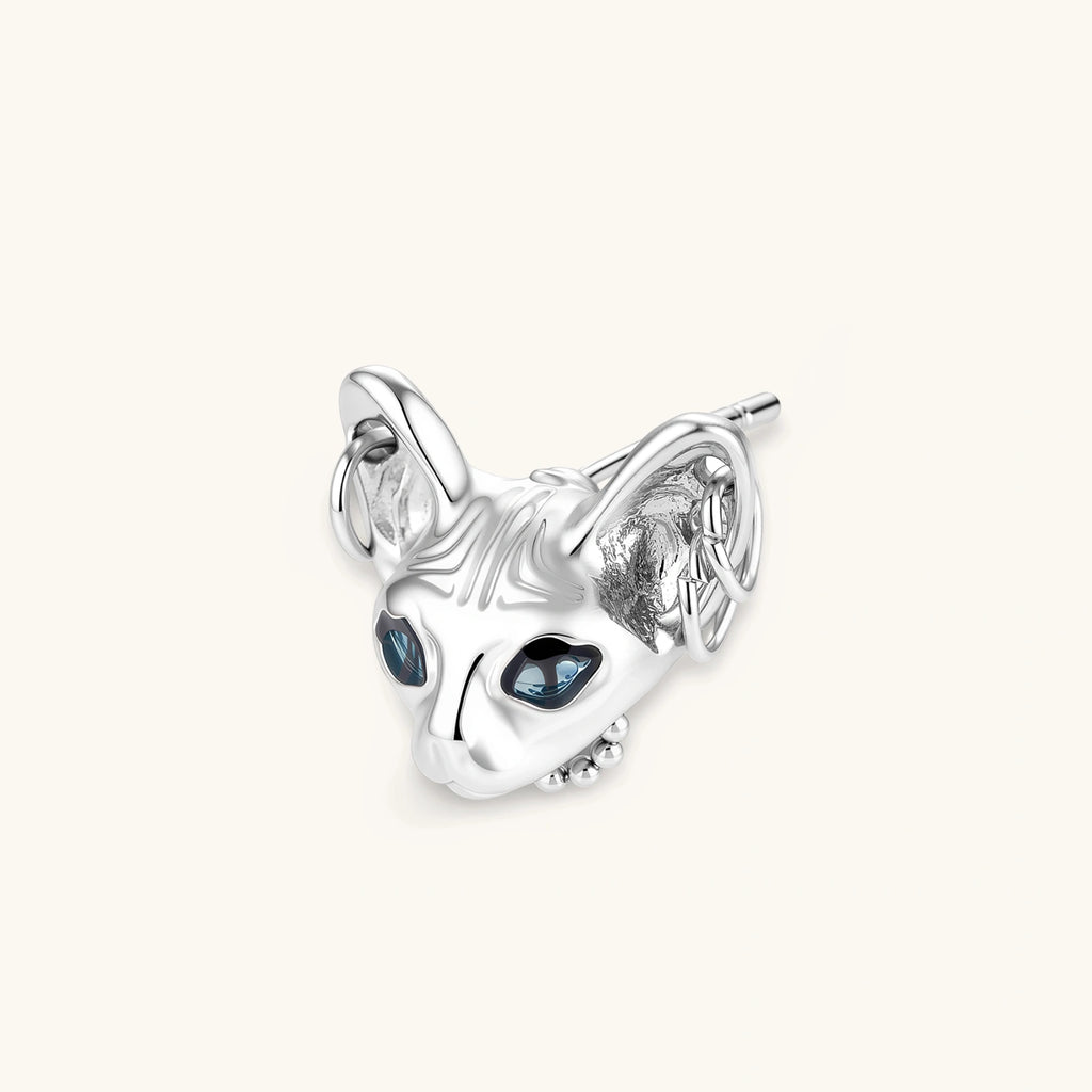 3D sculpted stainless steel Sphynx cat head stud earring with blue CZ eyes and hoop ear details, silver finish.