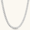 Silver 316L stainless steel carved curb chain necklace with lobster clasp and extender, 7.2mm wide, on cream background.