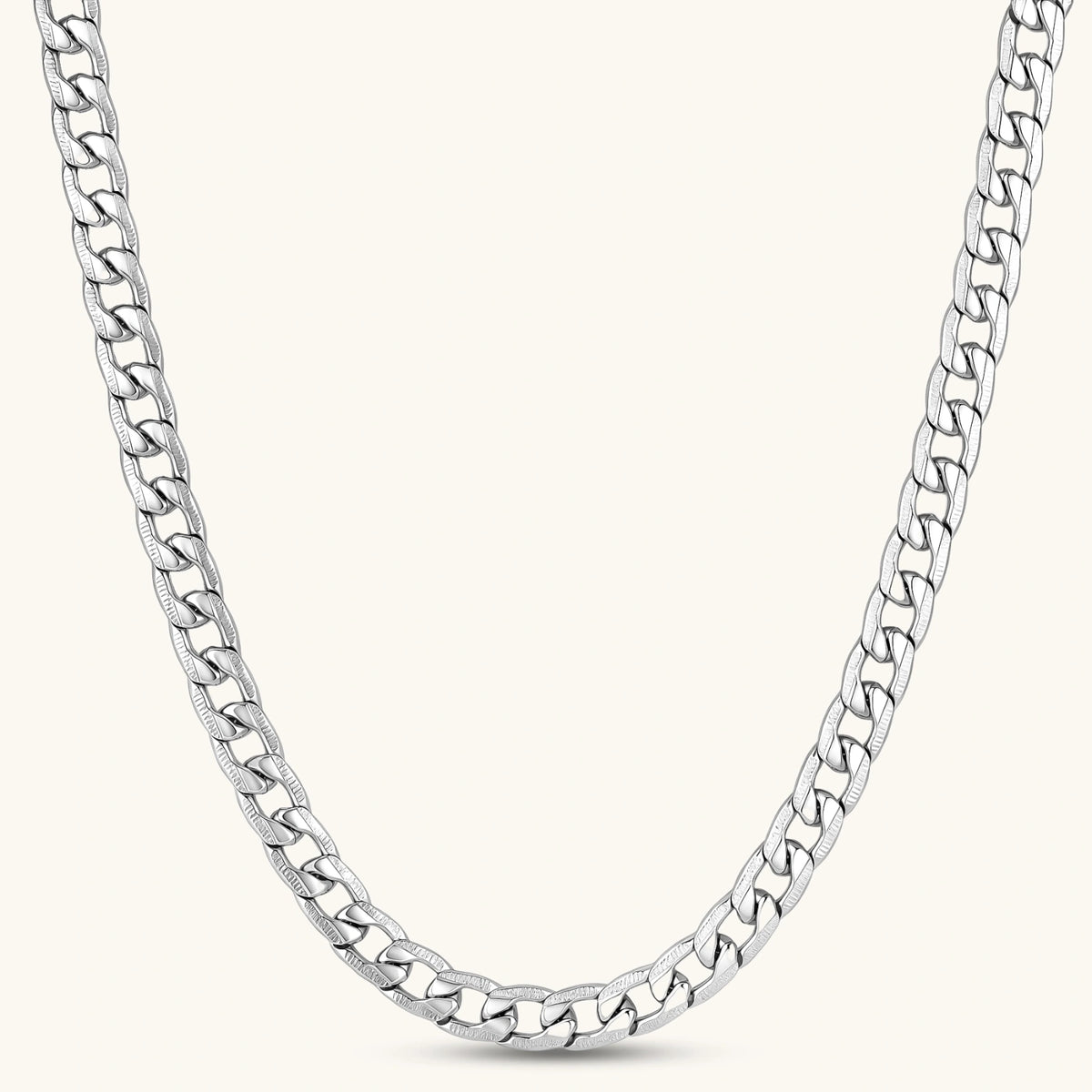 Silver 316L stainless steel carved curb chain necklace with lobster clasp and extender, 7.2mm wide, on cream background.