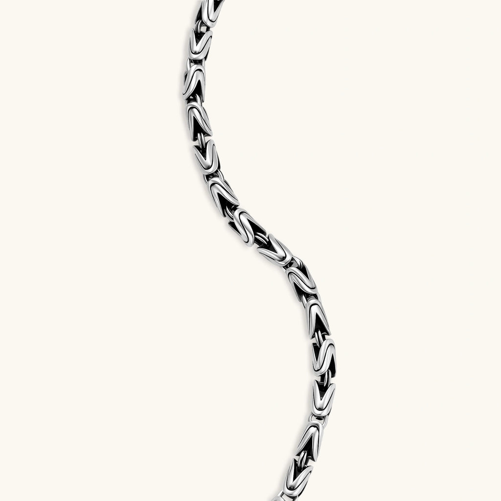 Men's antique silver Byzantine chain necklace, 6.2mm wide interlocking S-link pattern with ornate lobster clasp, 560mm length.