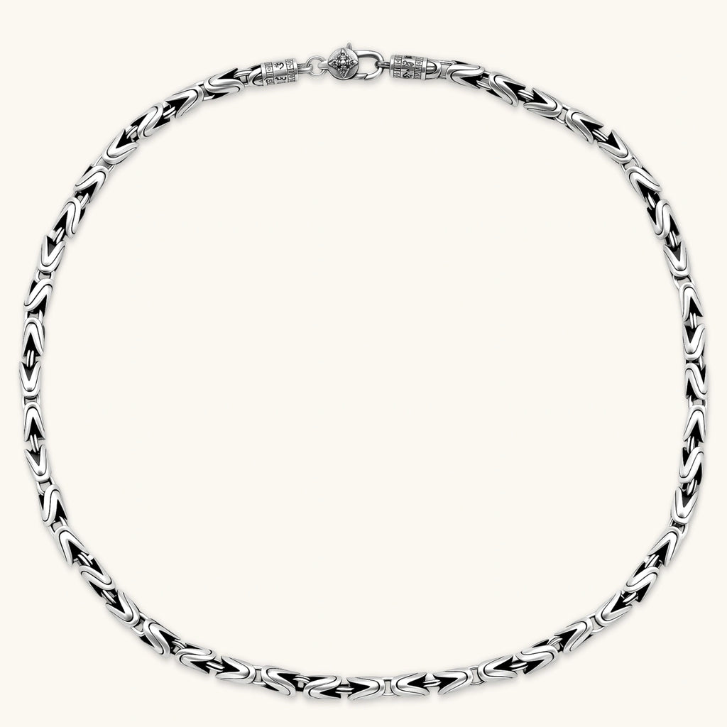 Men's antique silver Byzantine chain necklace, 6.2mm wide interlocking S-link pattern with ornate lobster clasp, 560mm length.