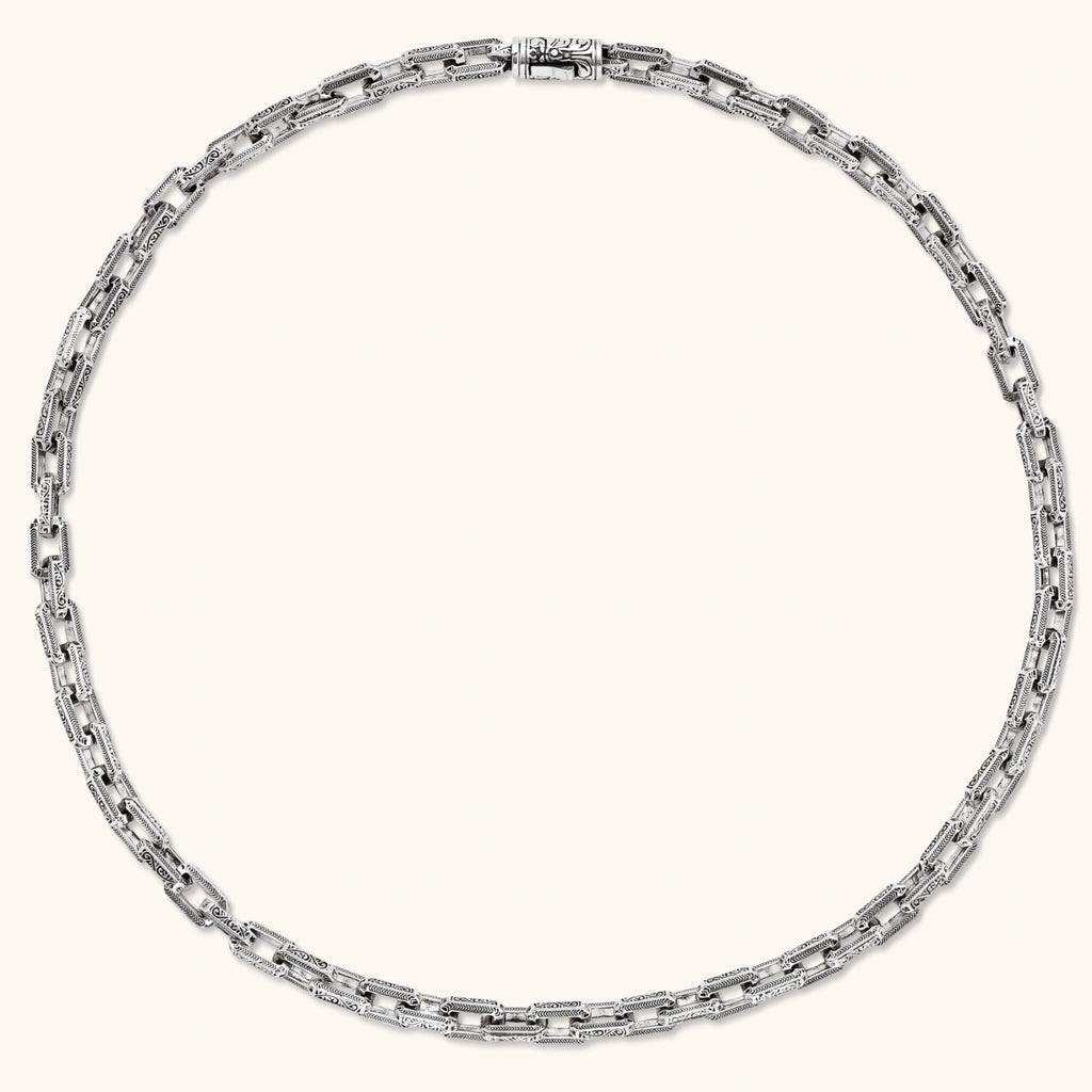 Silver 316L stainless steel rectangular link chain necklace with intricate scroll engravings, 560mm length, 7.1mm width.