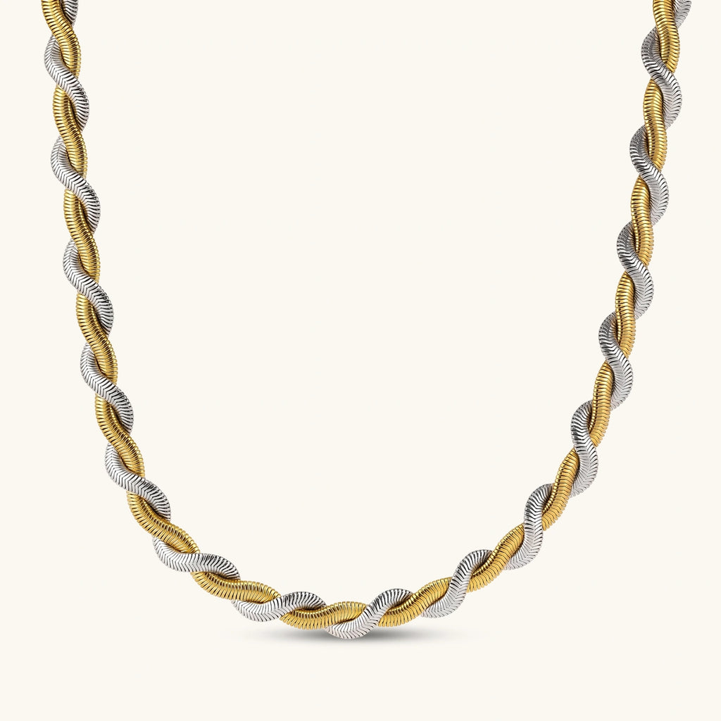 Two-tone twisted necklace with interlocked gold and silver ribbed snake chains, 6mm wide, on a white background.