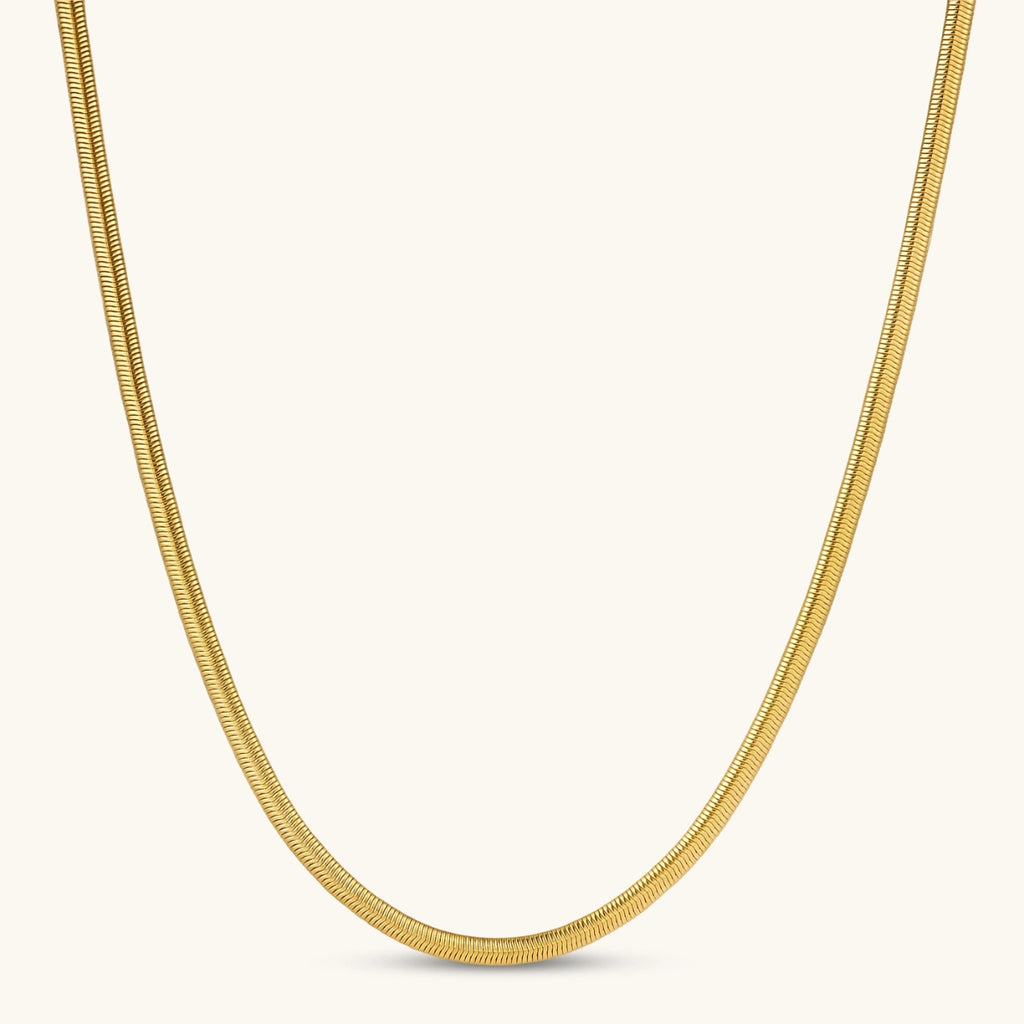 Two-tone twisted necklace with interlocked gold and silver ribbed snake chains, 6mm wide, on a white background.