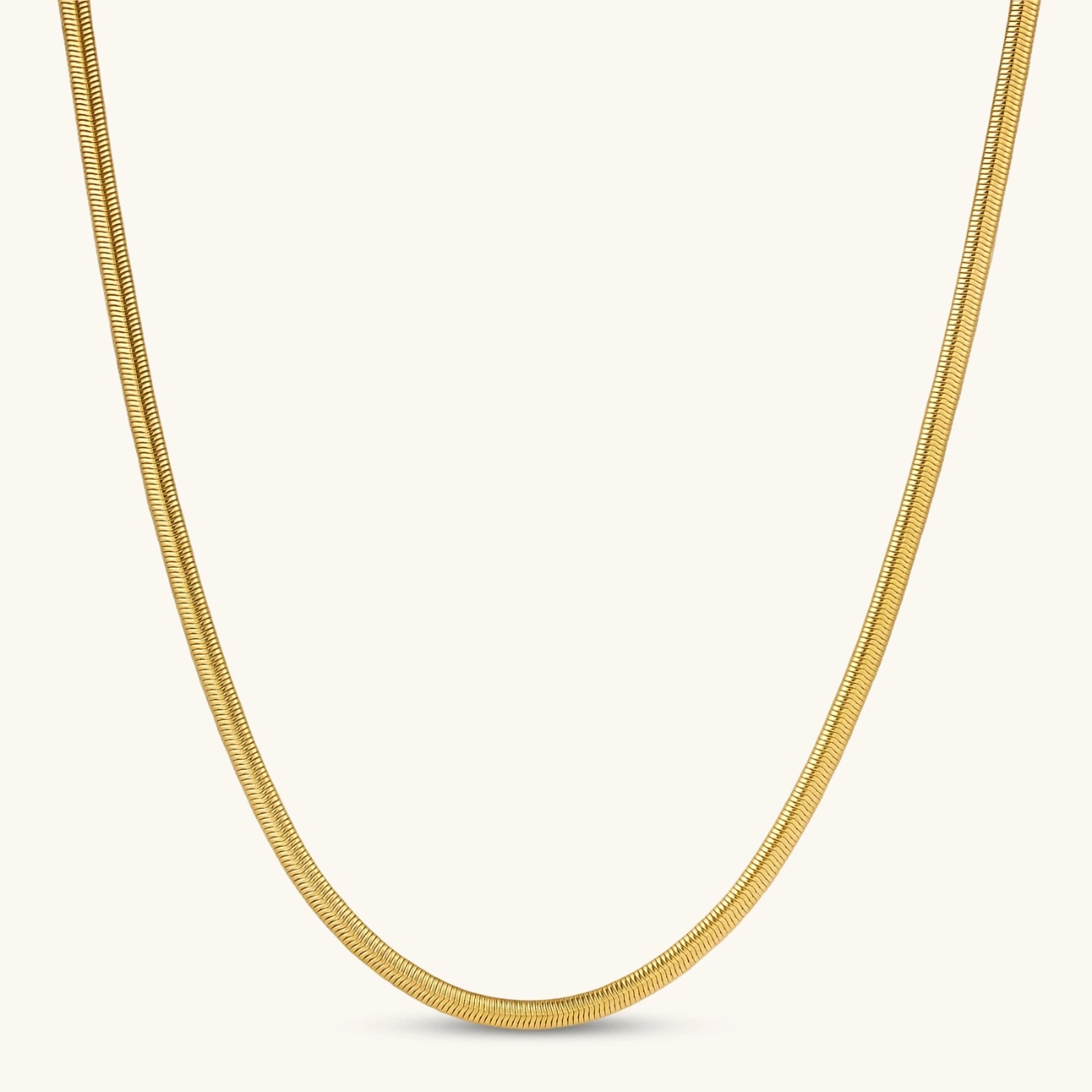 Two-tone twisted necklace with interlocked gold and silver ribbed snake chains, 6mm wide, on a white background.