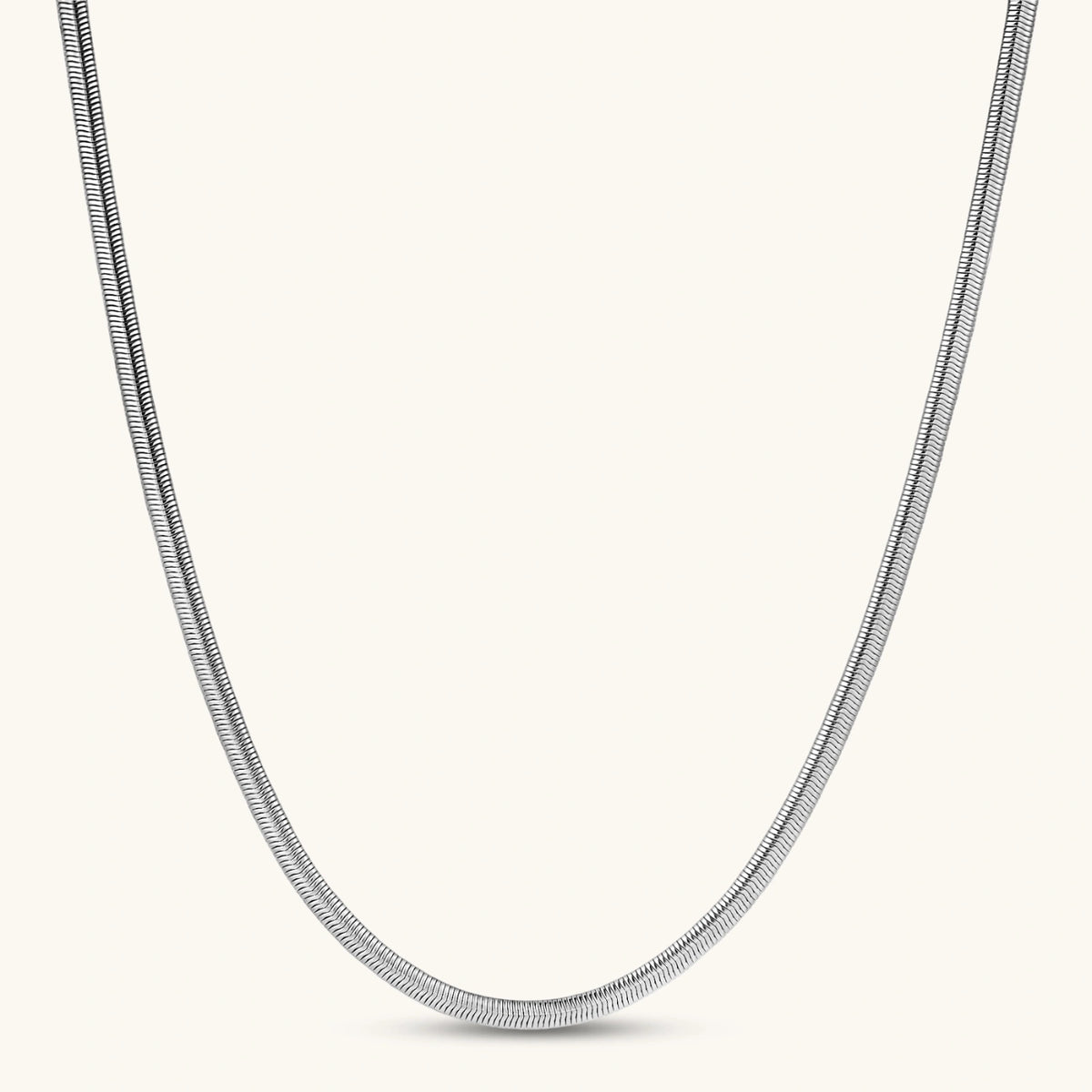 Two-tone twisted necklace with interlocked gold and silver ribbed snake chains, 6mm wide, on a white background.