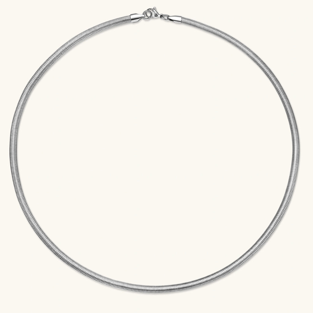 Two-tone twisted necklace with interlocked gold and silver ribbed snake chains, 6mm wide, on a white background.