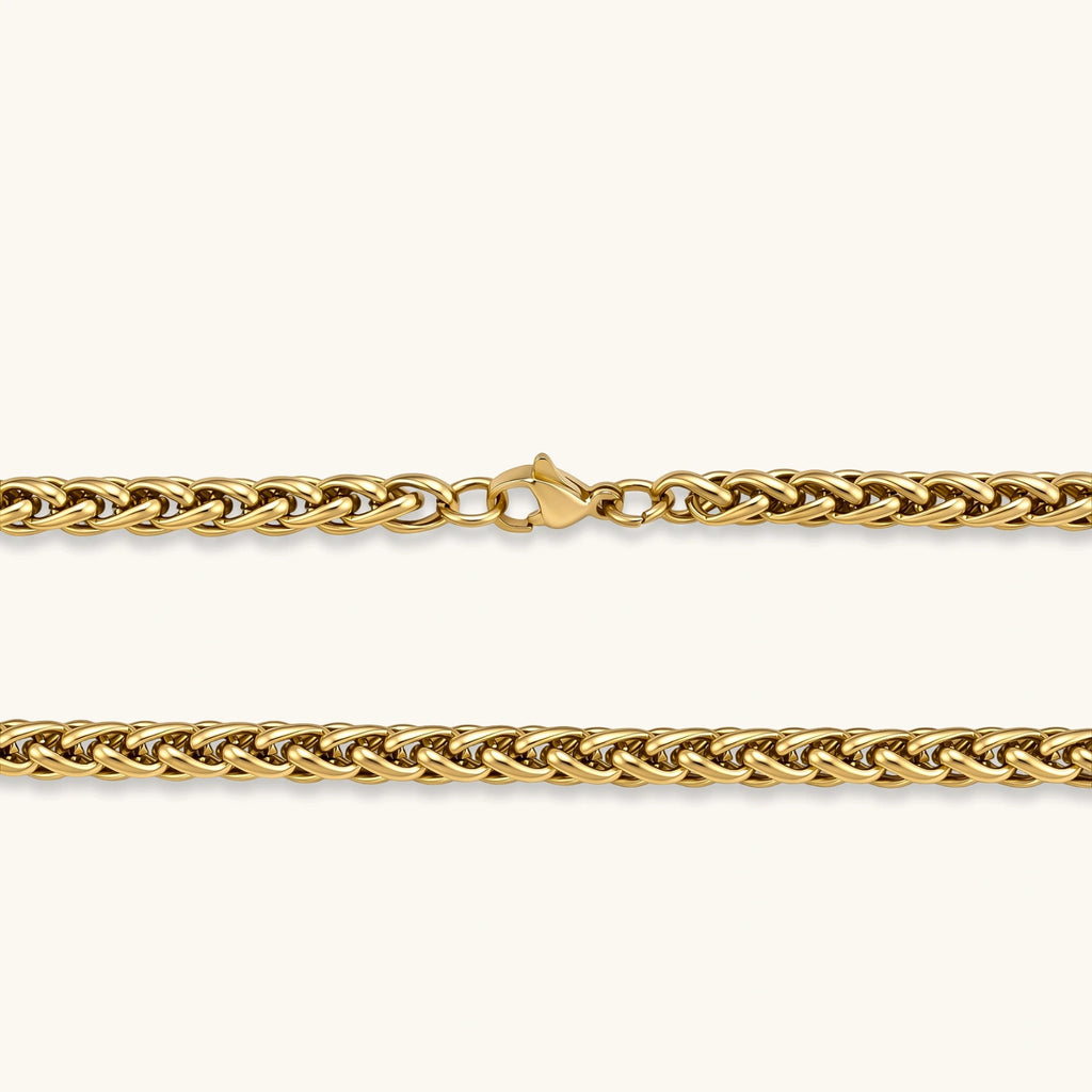 18K gold-plated stainless steel wheat chain necklace, 4.2mm wide, with lobster clasp, on off-white background.