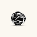 Silver stainless steel ring with bold skull face and coiled snake wrapping the crown, blackened recessed details.