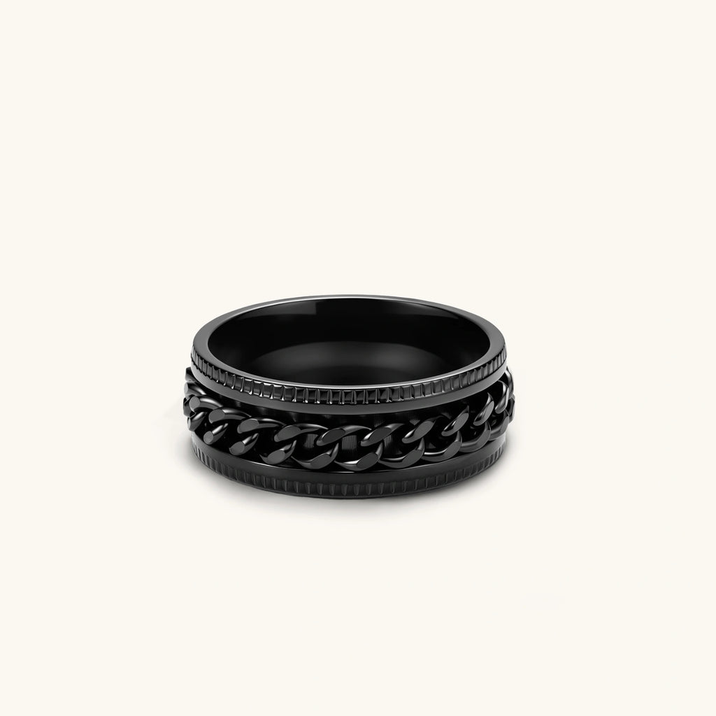 Black PVD-plated stainless steel band ring with a rotating Cuban chain center strip and ridged edges, 8mm wide.