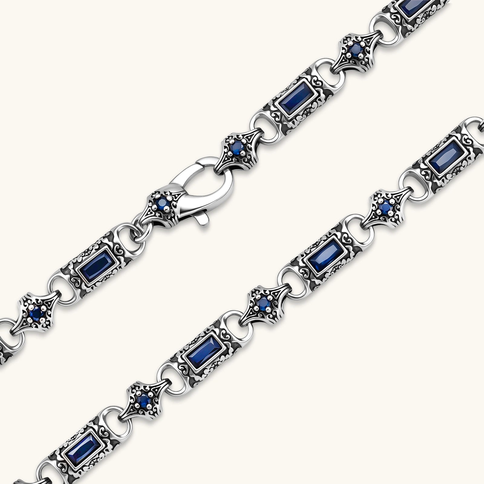Oxidized silver 316L stainless steel chain necklace with rectangular navy CZ links and ornate gothic connector pieces, 640mm.