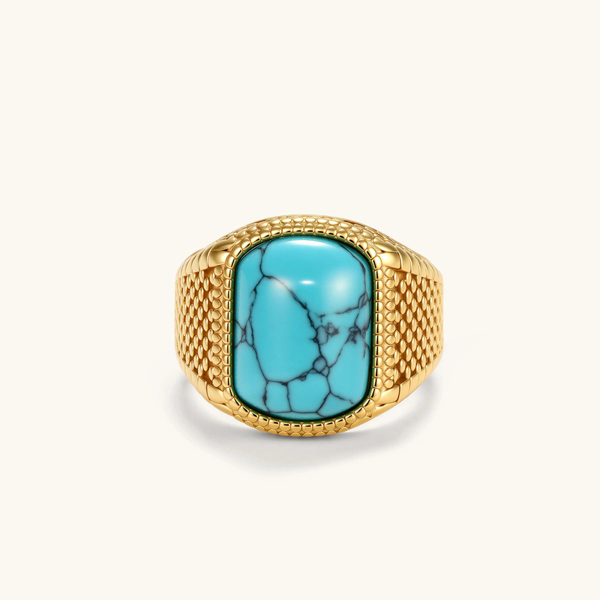 Gold PVD stainless steel signet ring with cushion faux turquoise stone and textured honeycomb band, front view.